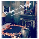 Romance package ad with peach colored roses in a heart shape on the bed.