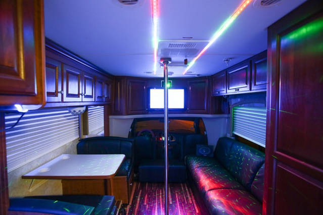 Seating area and table of Party Bus