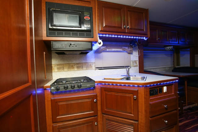 Stovetop and sink inside the Party Bus
